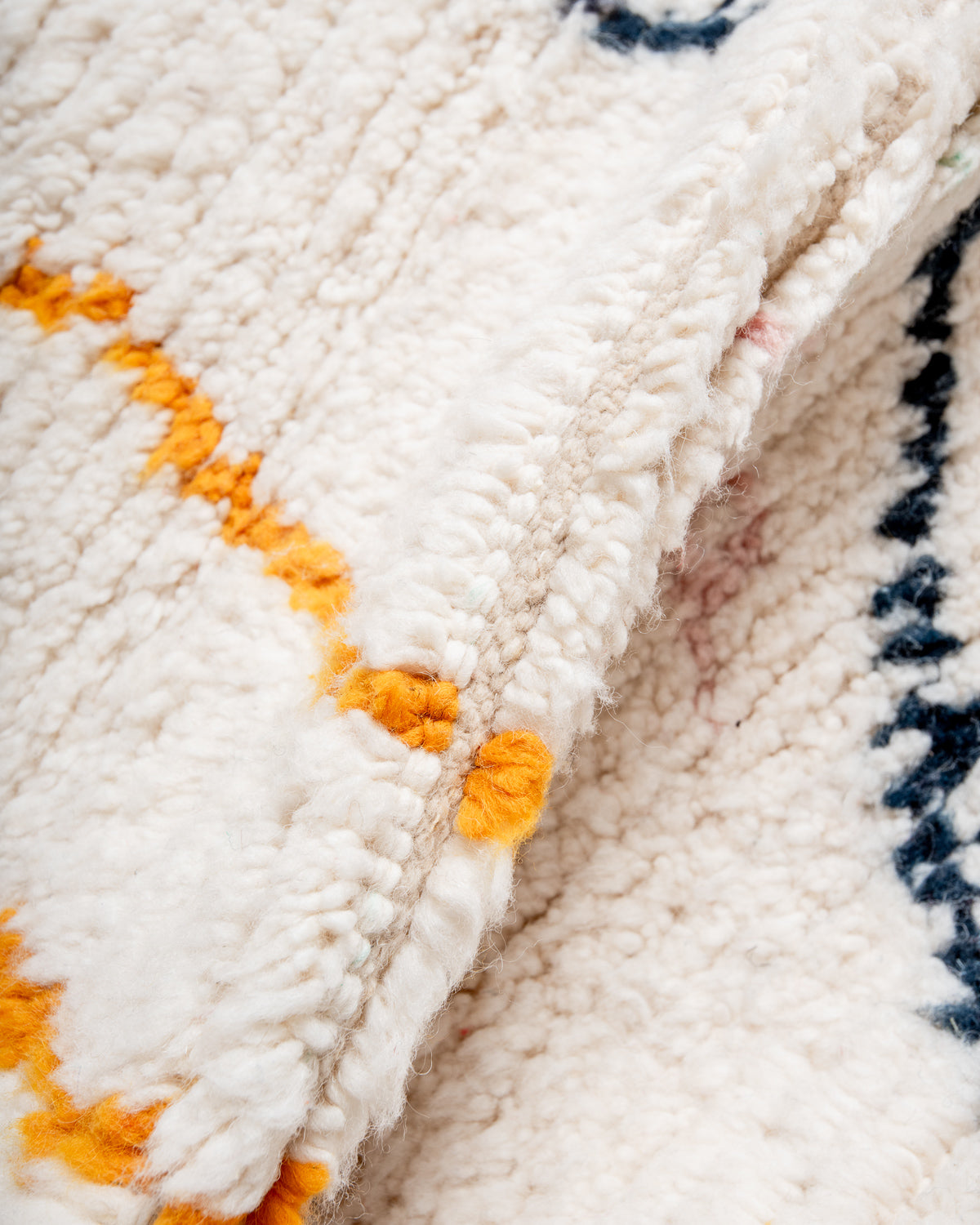 Modern, designer, handcrafted Berber rug from Morocco. Beniourain carpet with beautiful colours and patterns and fluffy wool texture.